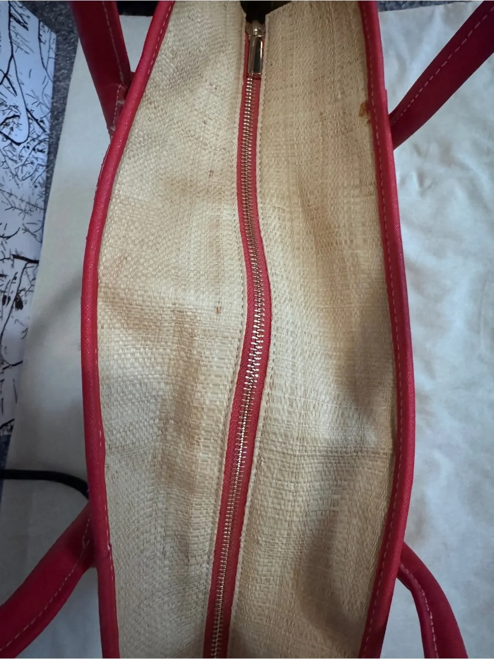 Tory Burch straw tote features vibrant red leather stripes